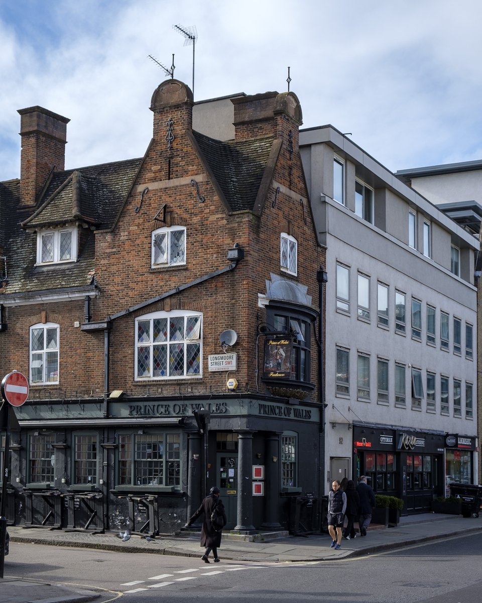 The Prince of Wales - Pimlico was rebuilt in its present form in 1925, though it could pass for a medieval building just as well with its Dutch gables, small pane windows, and rustic details.