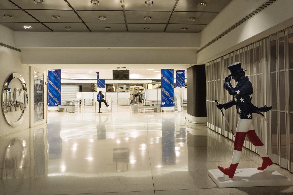 Inside the departures area, shops were closed, or boarded up.