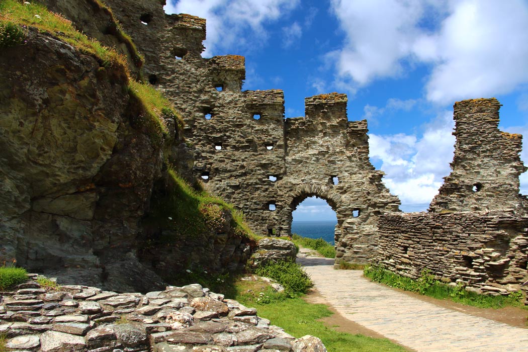 Some famous Arthurian sites are in modern-day England, notably:• Tre war Venydh (English: Tintagel). Cornwall's "village on a mountain" - comparable with Welsh "Tref ar Fynydd"• Glastonbury. It's claimed the town was founded by Glast, a descendant of Cunedda, King of Gwynedd