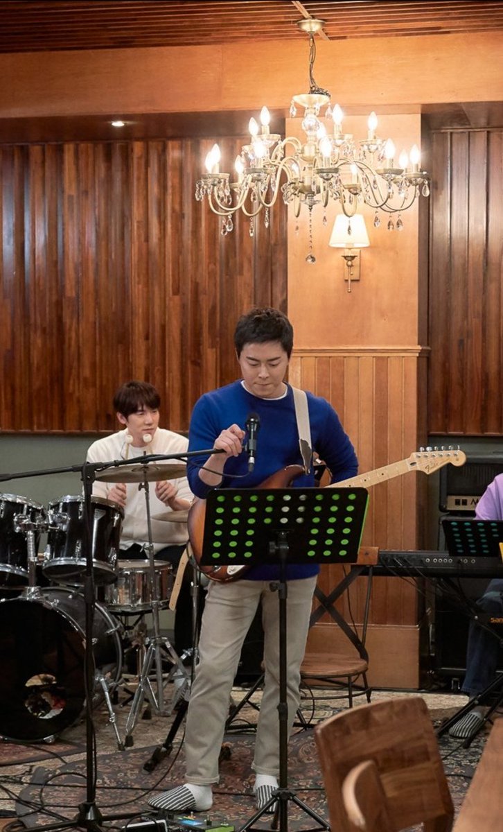 Ep. 7 - Bluish gray longsleeve shirt & black pant (he's wearing a pair of chuck taylors!), and a nicely fitted blue sweater and khaki pants (again, the bag!)Band perf: You always