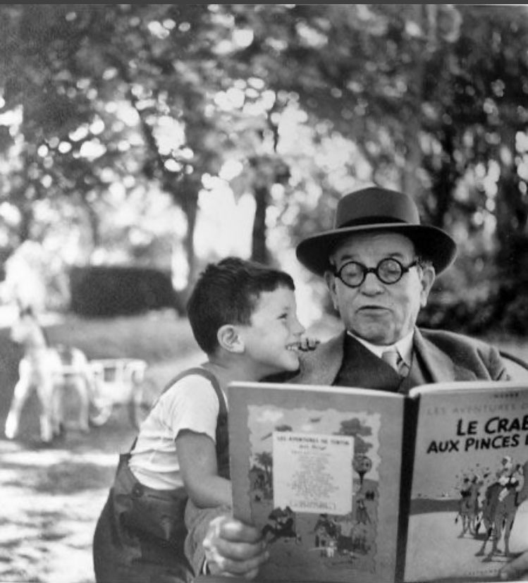 Elenalaion's tweet photo. Abuelo y nieto en el parque leyendo una de las aventuras de Tintín. 1952. 
📷#Janineniepce #7y77años #fotografia #borgoña #lectura #complicidad #tintin https://t.co/riNAn8xIny
