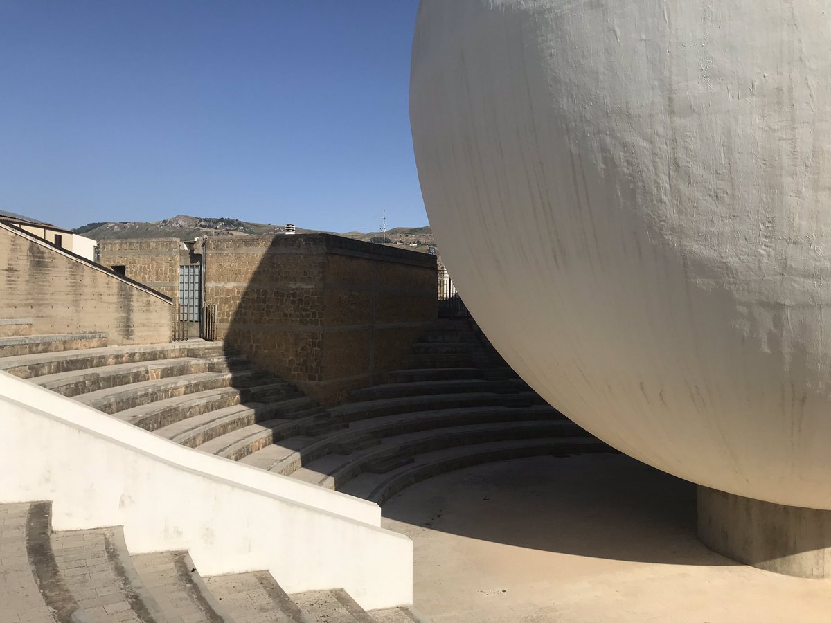 carmignacc's tweet photo. The ruins of #Poggioreale emerge from an arid landscape inundated with a symphony of cicadas sounds.The post-earthquake new town of #Gibellina, instead, stays in silence: very few people live in this utopian artscape. And cicadas may not even enjoy #Quaroni’s design #ghosttowns https://t.co/h4eiN9yCrl