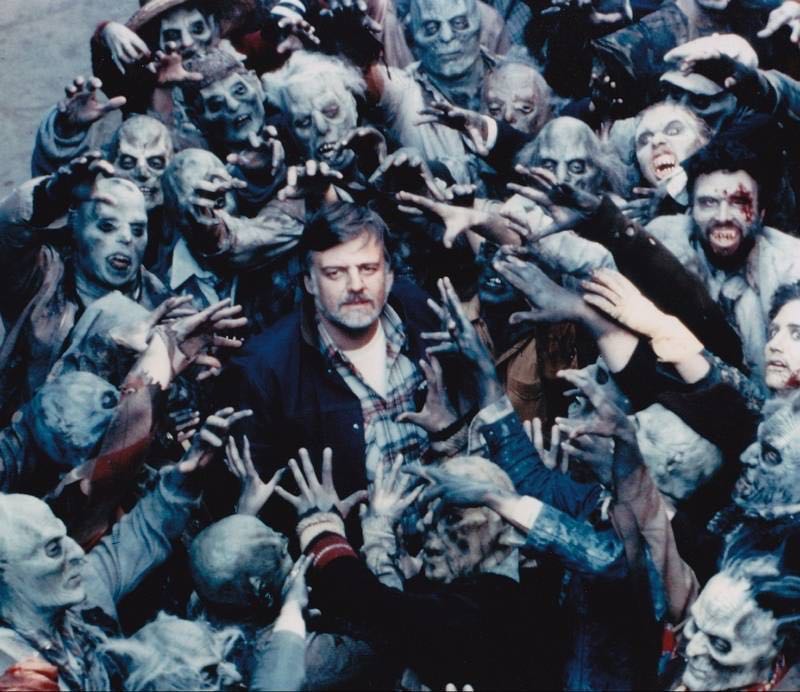 George Romero surrounded by zombies during the filming of Day of the Dead (1985) #80s #Horror #movies #DayOfTheDead