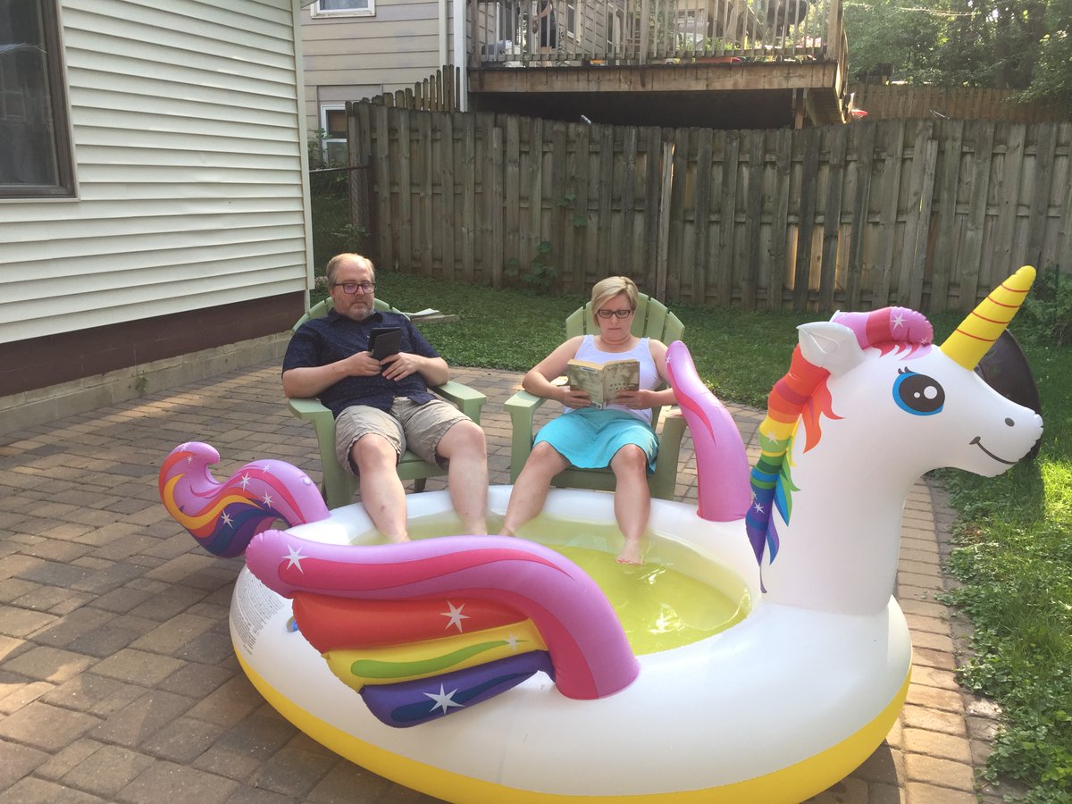 cmspillers's tweet photo. My sweet husband joined me for #readingbythepool on this  steamy evening! How are you staying cool?  @RPSGage @GageElementary https://t.co/szYD5PyGNz