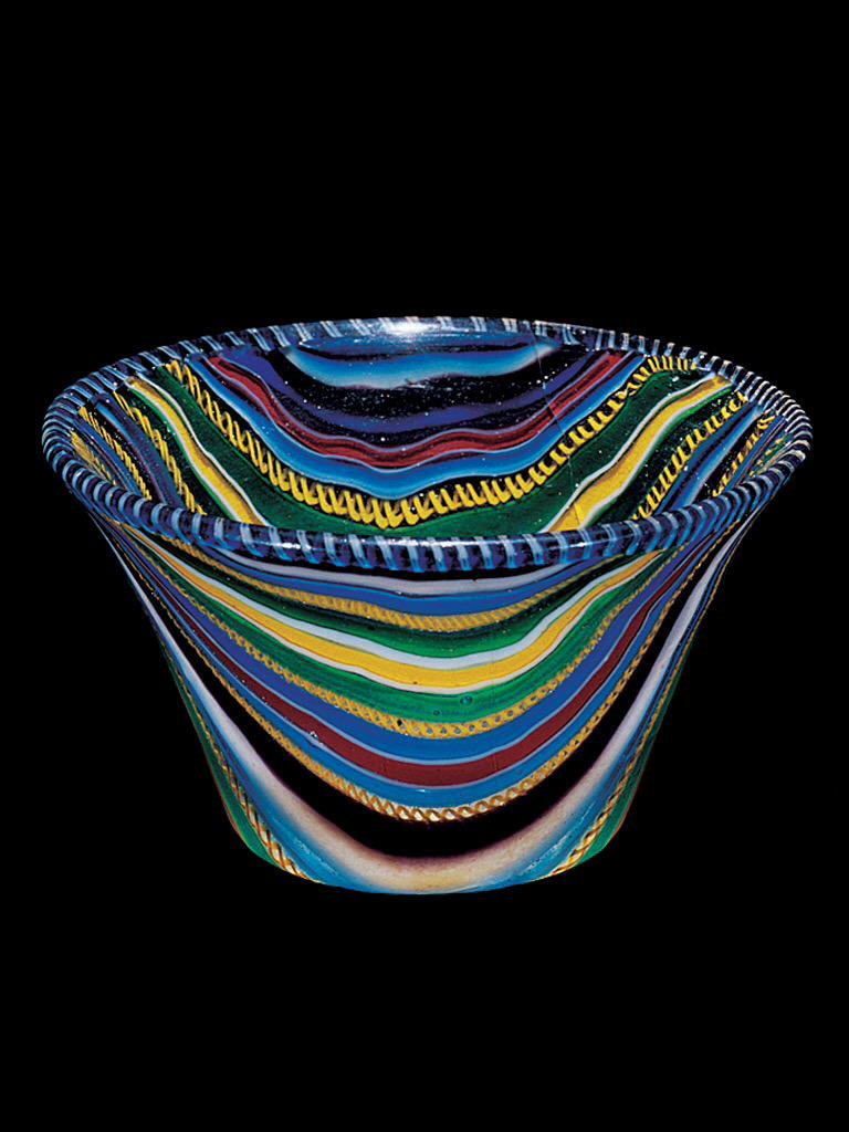 A Roman 'ribbon glass cup', probably made Italy in about 25 BC-50 AD:  https://blog.cmog.org/2011/06/27/antiquity-or-contemporary/