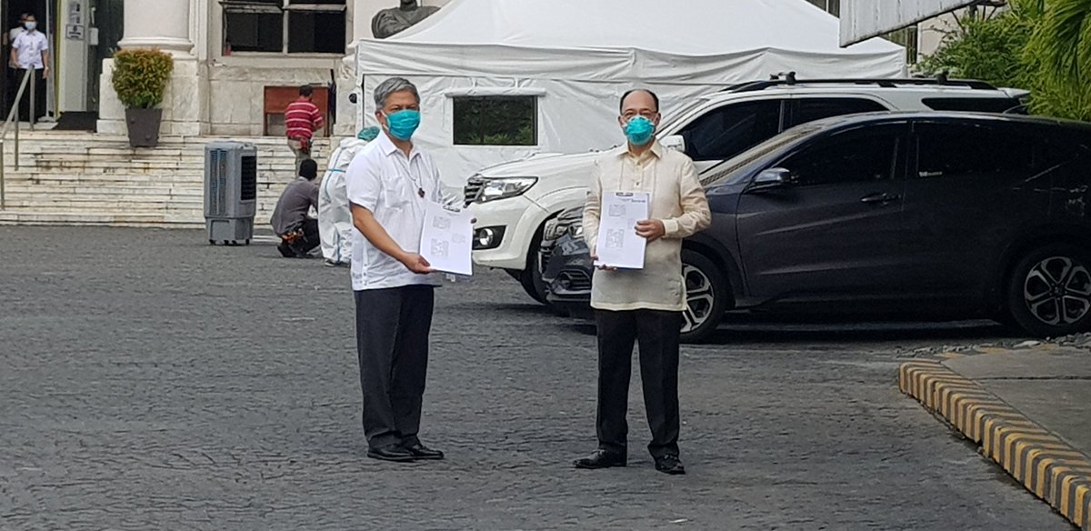 LOOK: Atty. Howard Calleja and Bro. Armin Luistro hold a copy of their filed petition vs Anti-Terrorism Act. | via  @mikenavallo