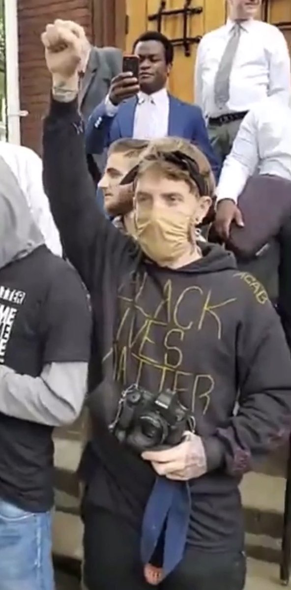 realgbctroyny's tweet image. Meet Chris Canfield, very identifiable tattoos, as he blocks a black lady from entering, shoves our pastor, then delivers punches to a man from the church attempting to get through up the stairs.

“Peaceful protest”