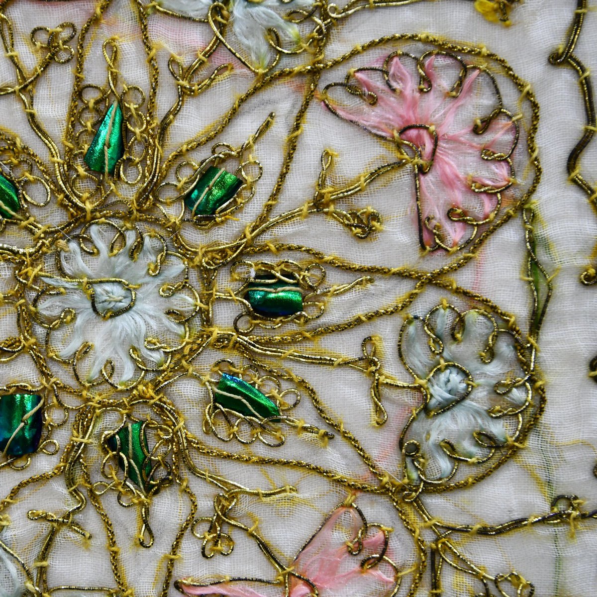 Tex_Con_Ltd's tweet photo. #macromonday today showing this embroidery with  shining, emerald-green iridescent, and glamorous beetle wings used as decoration motif which give it a special touch.

#textileconservation #beetlewings https://t.co/kapMIQmBM5