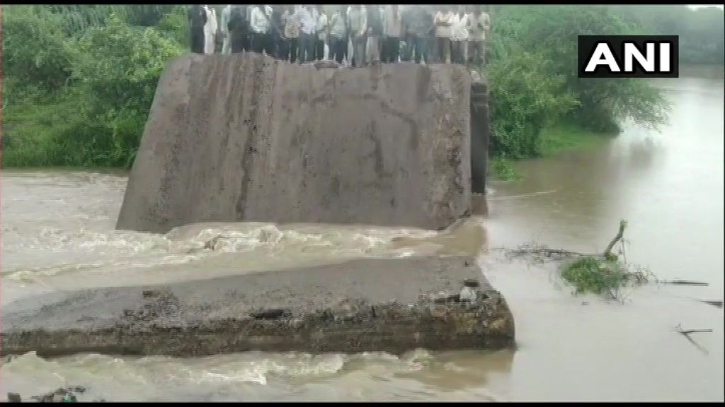 ANI's tweet photo. Gujarat: A newly-built bridge in Bamnasa village of Junagadh collapses following heavy rainfall. https://t.co/oySMjJSg8c