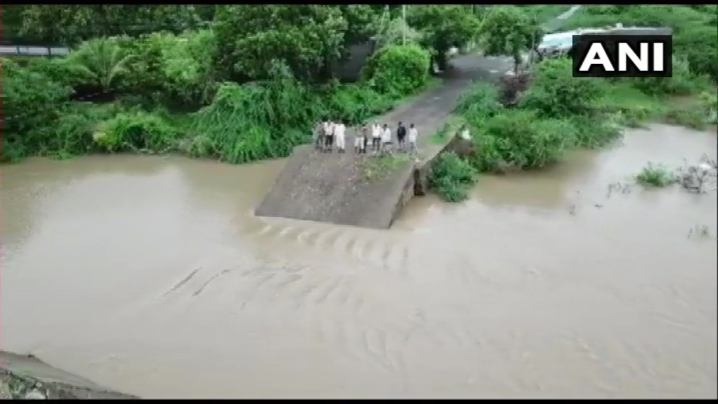 ANI's tweet photo. Gujarat: A newly-built bridge in Bamnasa village of Junagadh collapses following heavy rainfall. https://t.co/oySMjJSg8c