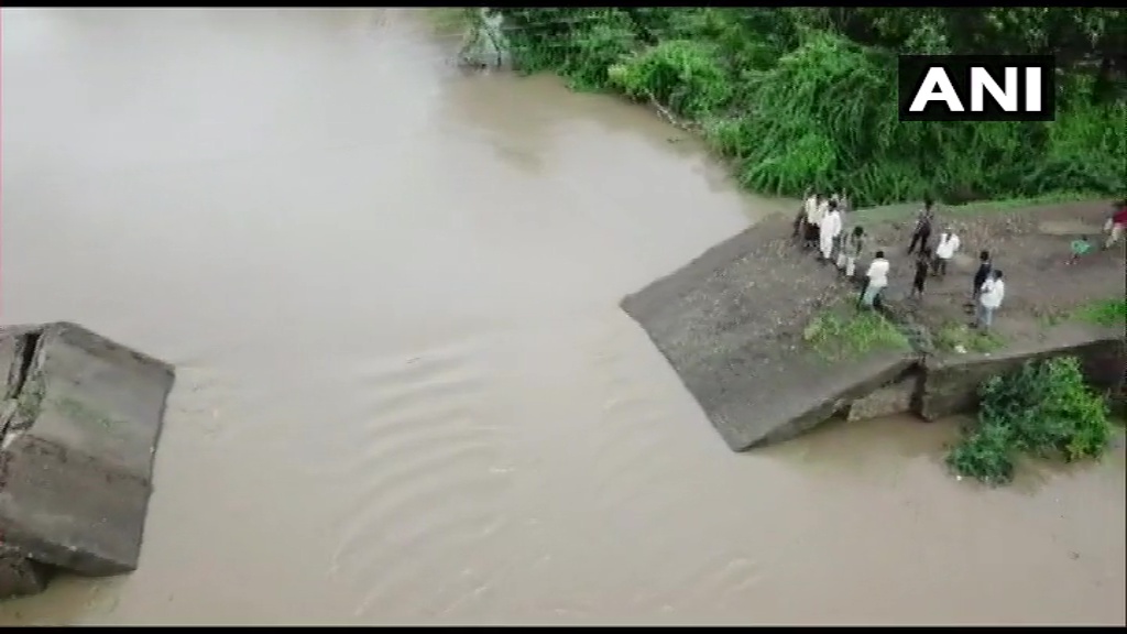 ANI's tweet photo. Gujarat: A newly-built bridge in Bamnasa village of Junagadh collapses following heavy rainfall. https://t.co/oySMjJSg8c