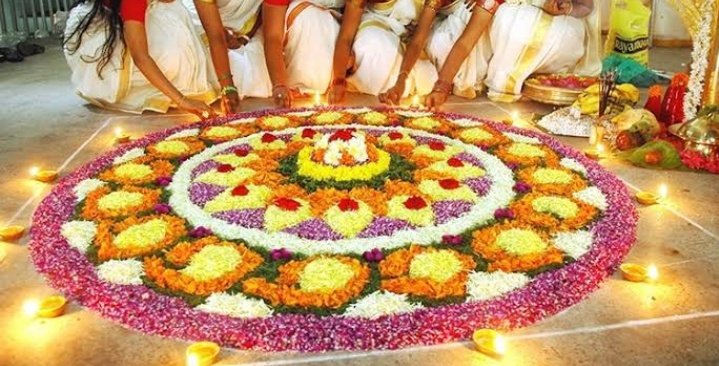 (Chungha) there seems to be a circle of flowers she's standing on. it's called 'pookalam' it's a part of a festival called 'Onam' it is a Hindu festival celebrated in Kerala, India.