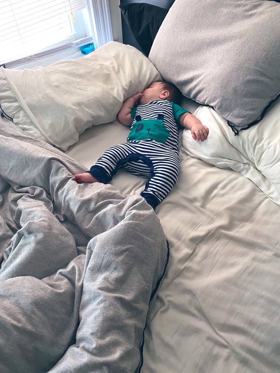 k_0brien's tweet photo. I’m so in love with this little human, even when he takes my spot in the bed https://t.co/vOOuF50l1U