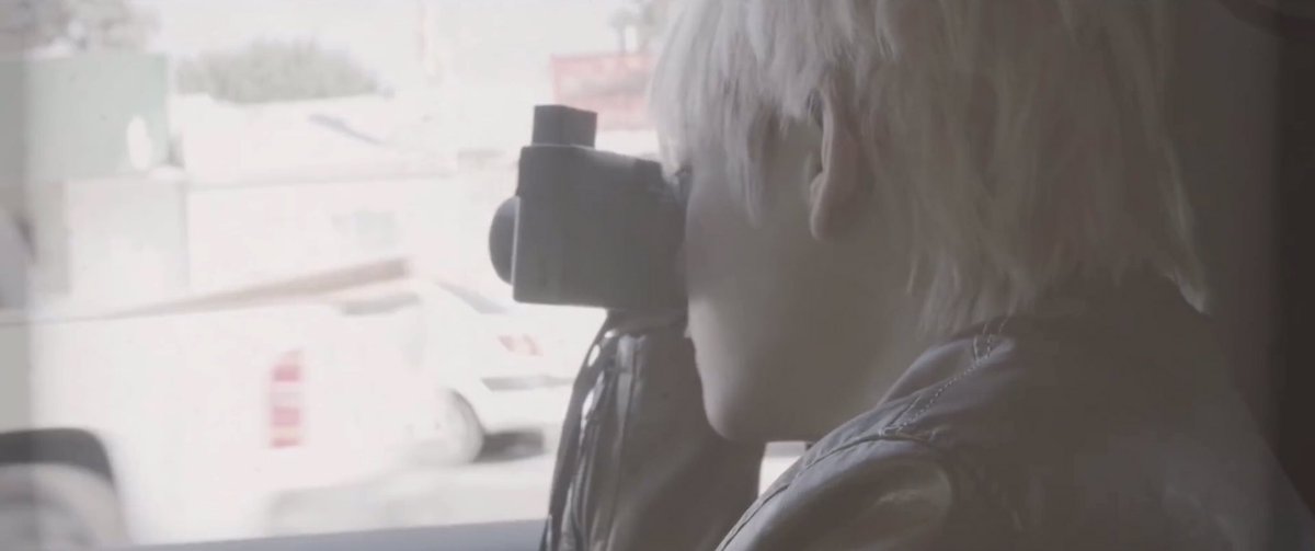 He uses the concept of traveling not only in the sense of moving from one space to another, but also w/ time. In the MV we see clips of Taehyung in his travels & takes pictures of them. The camera is a timetraveling device in the sense that it allows him revisit these moments.