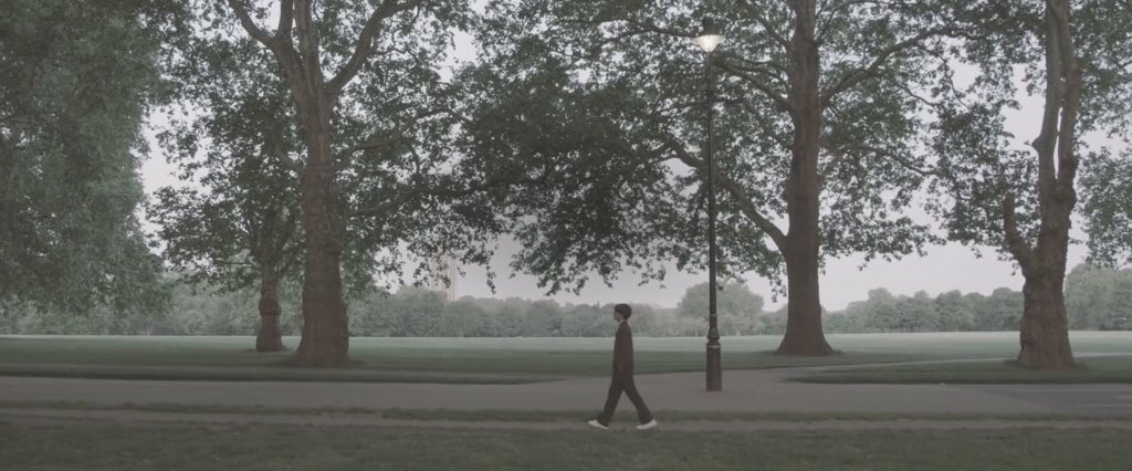 Eventually Taehyung turns around and walks straight ahead into the night - the effects of light leaks fade and we are brought to somewhere else - the green park where we see him earlier. Did Winter Bear MV-Taehyung successfully travel to his desired moment in time?