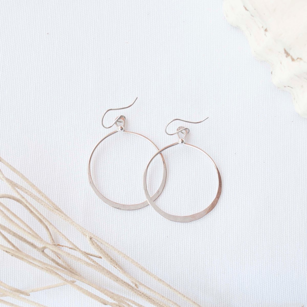 The NEW Round Goddess Earrings in shiny, tarnish free silver rhodium plated.
#modernearrings#hangingearrings#goldearings#longearrings#jewellerydesigns#simplejewelry#earringtrends#trendyearrings#statementaccessories#earringjewelry#goddessearrings #roundearrings #circleearrings