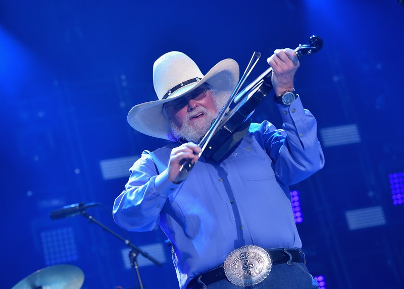 RDPFoodservice's tweet photo. @RDPFoodservice  is very sad to learn of the passing of country music legend #CharlieDaniels.  We had the pleasure of meeting and hosting Charlie at our 2006 RDP Food Show and Concert Series.  A guitar signed by Charlie hangs in our office front hallway.  Rest in peace Charlie. https://t.co/S5dDenoQhr