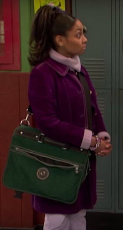 Purple denim, over lilac jumper, complete with purple flower hair clip and purple eyeshadow. Offset by a green messenger bag, tying the lewk together 