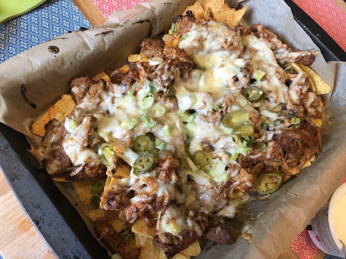 Nichola_Barron's tweet photo. Leftover pulled pork (from July @bbcgoodfood) can only mean one thing! Pulled pork nachos! Yaaas! 🙌🏻 Pure filth. #lockdownleftovers https://t.co/ls3bz8pazE