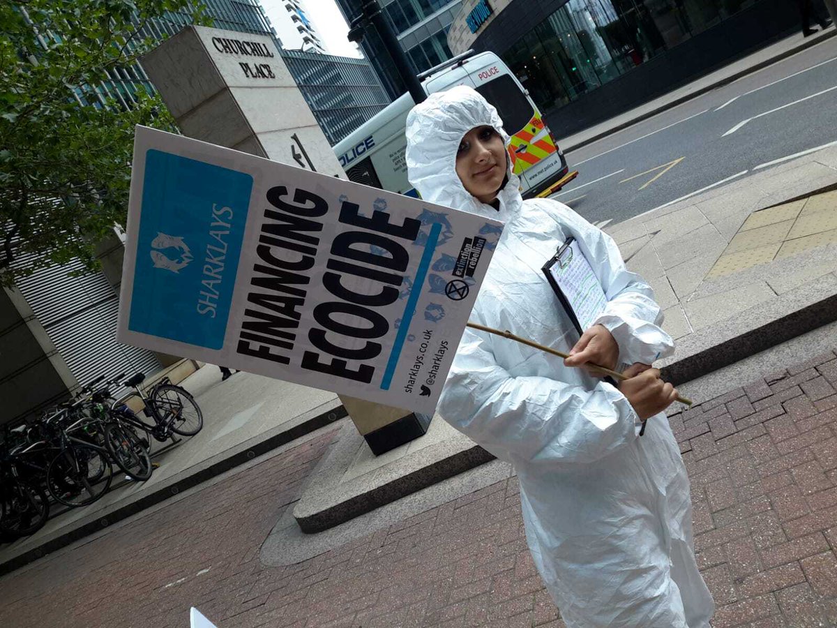 EcocideLaw's tweet photo. Spoof Sharklays  site launched with stunt at Barclays HQ today - we were there!
video: https://t.co/WpXBquGOiq
#ExtinctionRebellion 
#DAPL 
#NoDAPL https://t.co/uHBJIzNLPQ