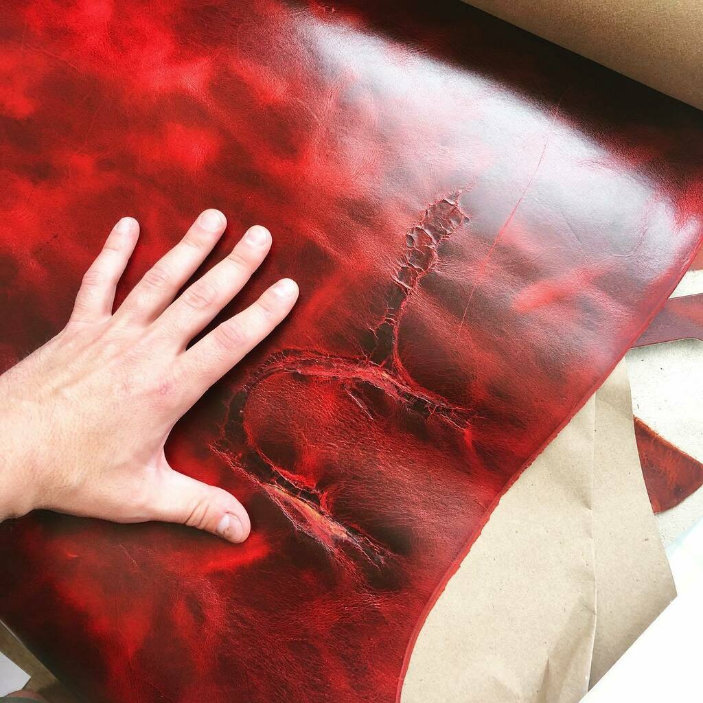caveleatherco's tweet photo. This leather is gorgeous! Ruby GenX from @acadialeather. Check out this gnarly scar! Message me if you want something made with it 👌 https://t.co/V8xp1qRZi8 https://t.co/TBa34urJo8
