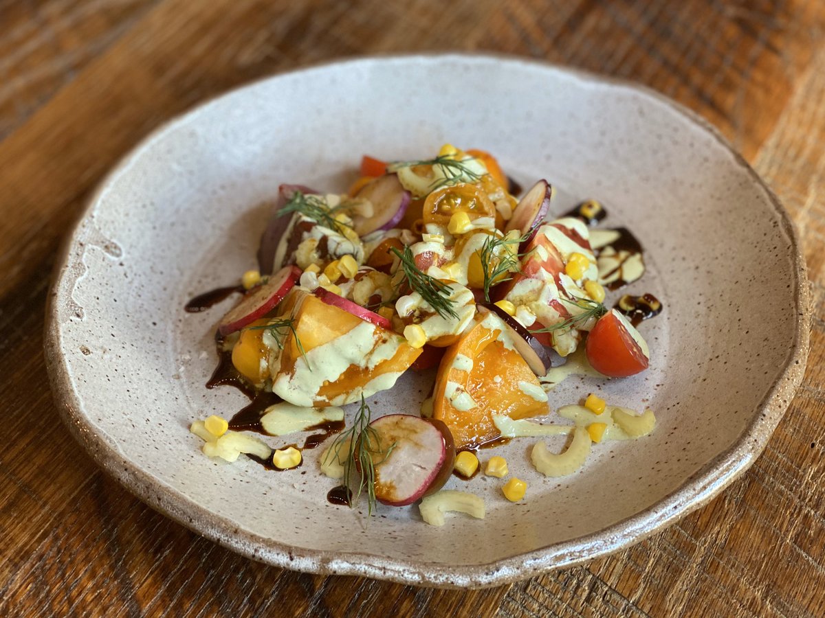 Tomatoe salad from @WhtSquirrelFarm is back on the menu !!  Along with Radish, dill, celery hearts, pickled corn, buttermilk herb dressing and black garlic molasses on @sumtripottery it’s a summer masterpiece!! 
#teamLT #tomatoes #salad #raw #summertime