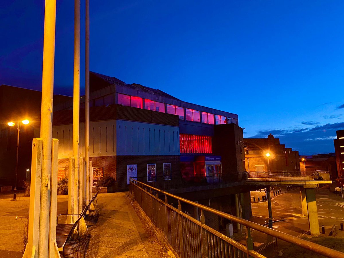 WyvernTheatre's tweet photo. As we remain on ‘standby’ - tonight the Wyvern &amp; the Arts Centre has been lit red.

We welcome the announcement of government support for the sector but don’t have a date for live performances to recommence.

We’re standing in solidarity with venues across the UK. #lightitinred https://t.co/H21YAqMMTv