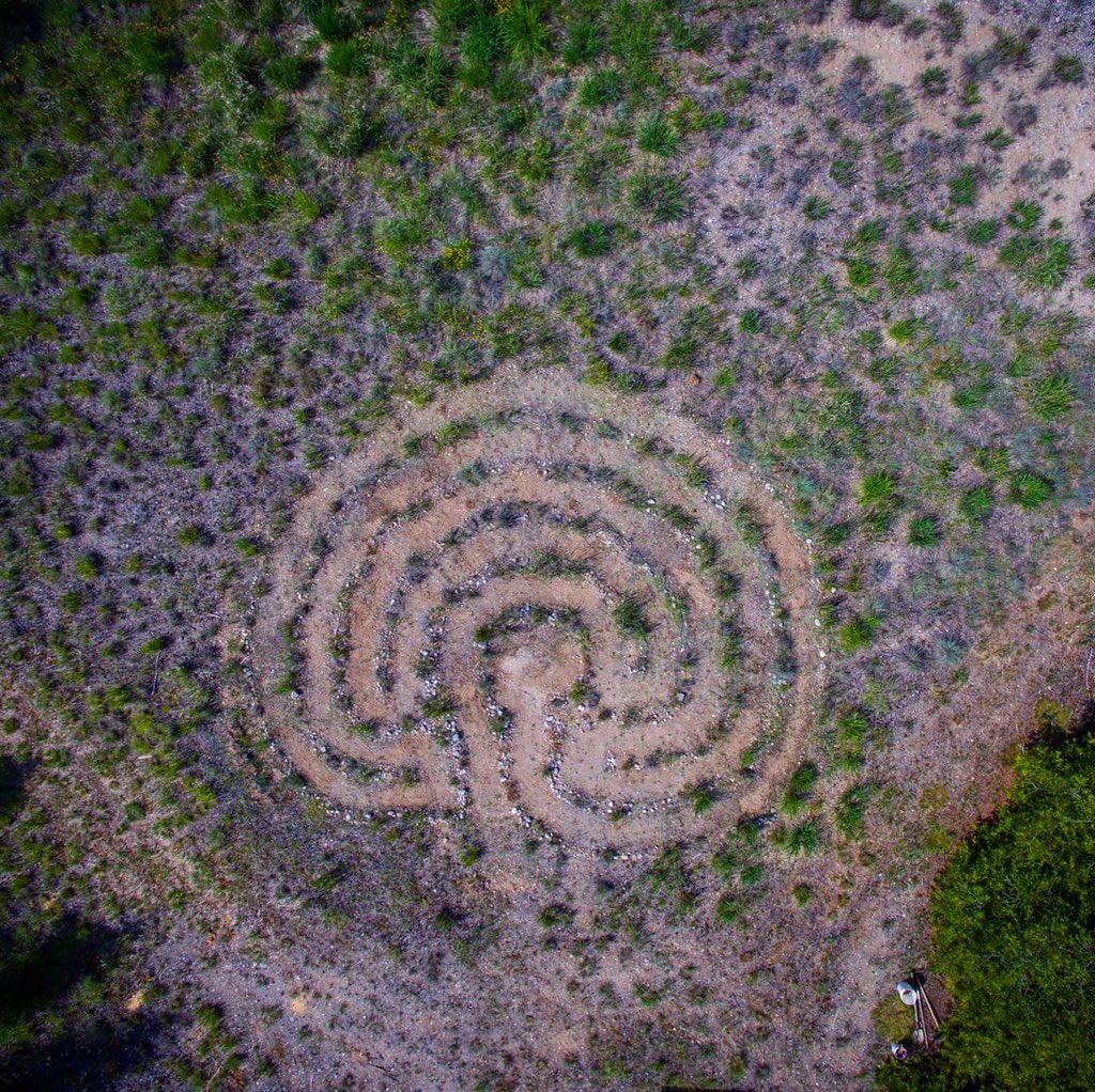 sjacksondesign's tweet photo. An aerial update of the #labyrinth I made. (40’ x 32’) It’s greened up considering the lack of rain. A lot of work yet to do but this heat is unbearable so - next year. #dronephotography #selfie https://t.co/6xypSHmoZY
