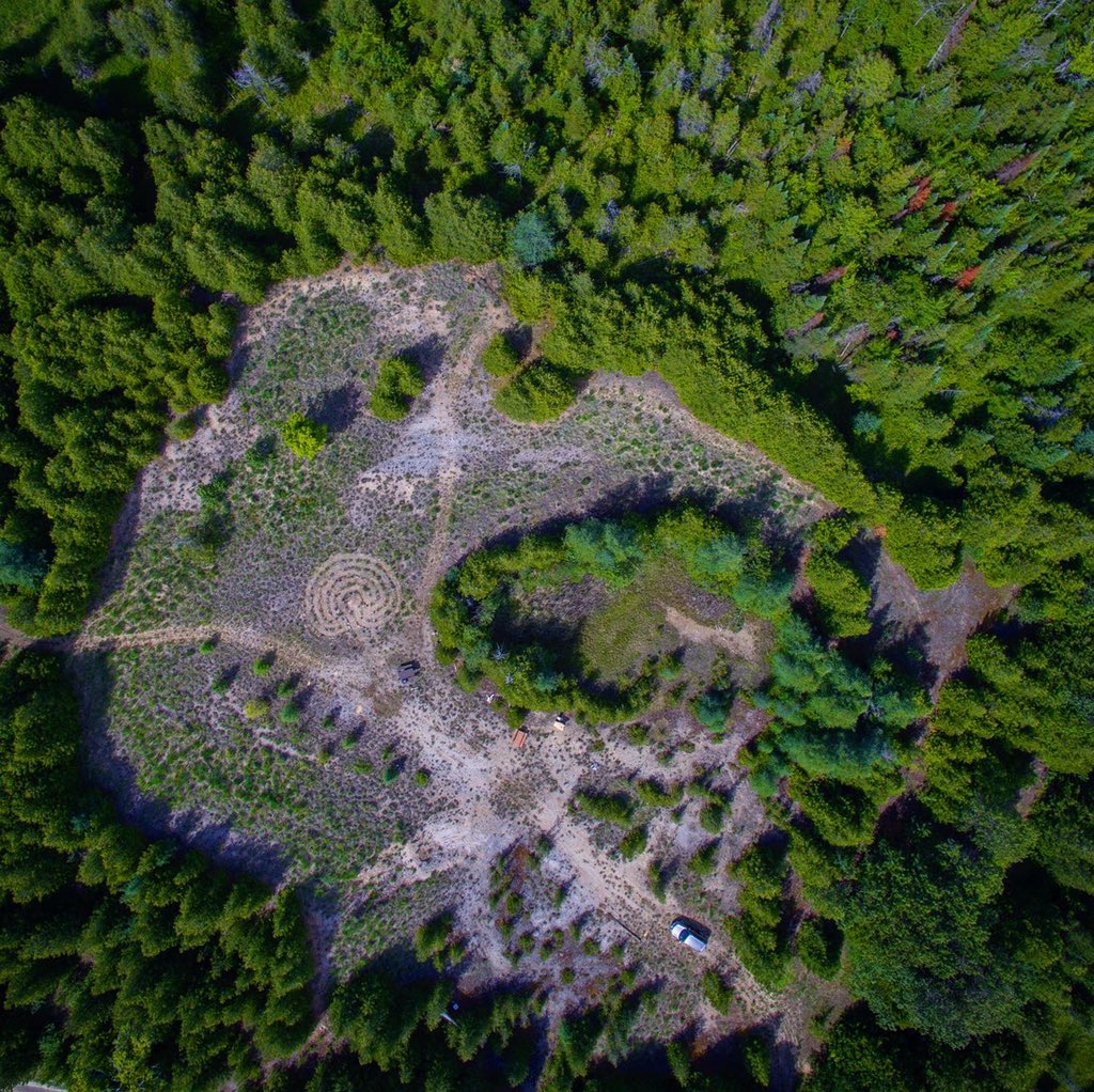 sjacksondesign's tweet photo. An aerial update of the #labyrinth I made. (40’ x 32’) It’s greened up considering the lack of rain. A lot of work yet to do but this heat is unbearable so - next year. #dronephotography #selfie https://t.co/6xypSHmoZY