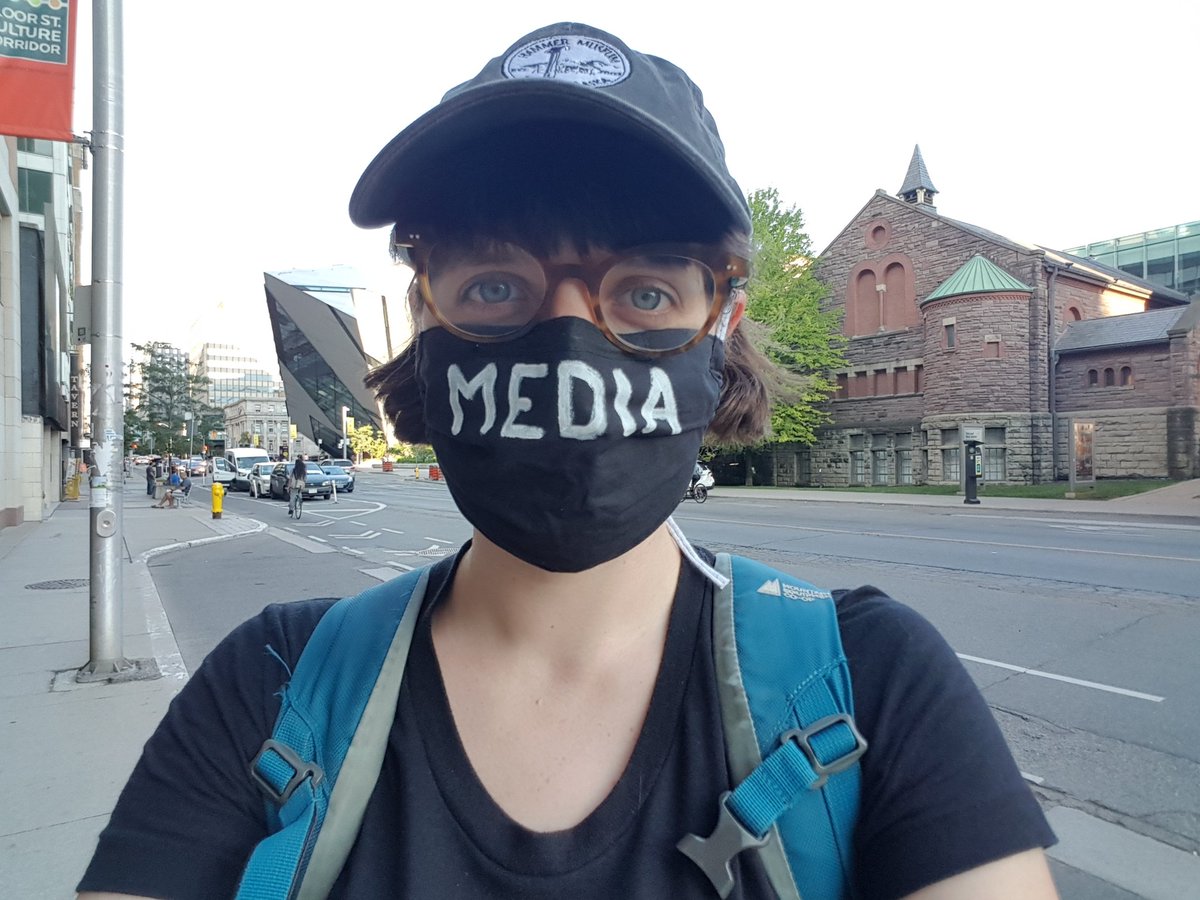 I literally left the fairly quiet protest at 7 to make it to my dinner plans (here is me walking away in my new media mask) and then had to SPRINT back as a line of police cars, sirens blazing, careened around the corner towards the protest. Sorry for the gap in coverage 