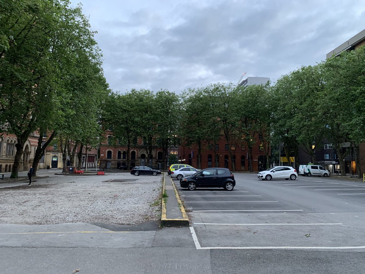 Potentially the nicest square in Manchester is used for storing cars. Imagine how nice this space could be.