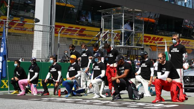 thehill's tweet photo. Formula One drivers take a knee, wear "End Racism" shirts at season opener https://t.co/cBcQUJVlLw https://t.co/LhnQlI7OAM