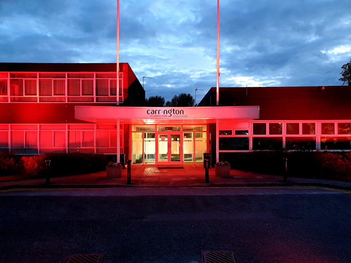 CarringtonBP's tweet photo. The business park lit up in red last night in support of the businesses in the events industry affected by Covid-19 #lightitinred #traffordcouncil @Fisherav @eventsstructure https://t.co/C0bjA7s1MW