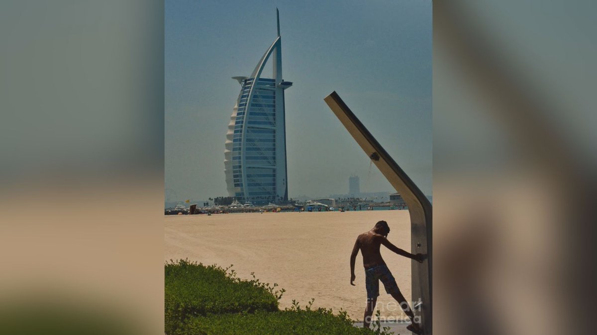 'Shower at Burj Al Arab' by @FlaneurPhotos  Check out this #photograph on @fineartamerica here> bit.ly/31UFqsC    #Dubai #UAE #VisitDubai #VisitUAE #beach #BurjAlArab #boy #shower #leisure #vacation #wallart #homedecor #artforsale