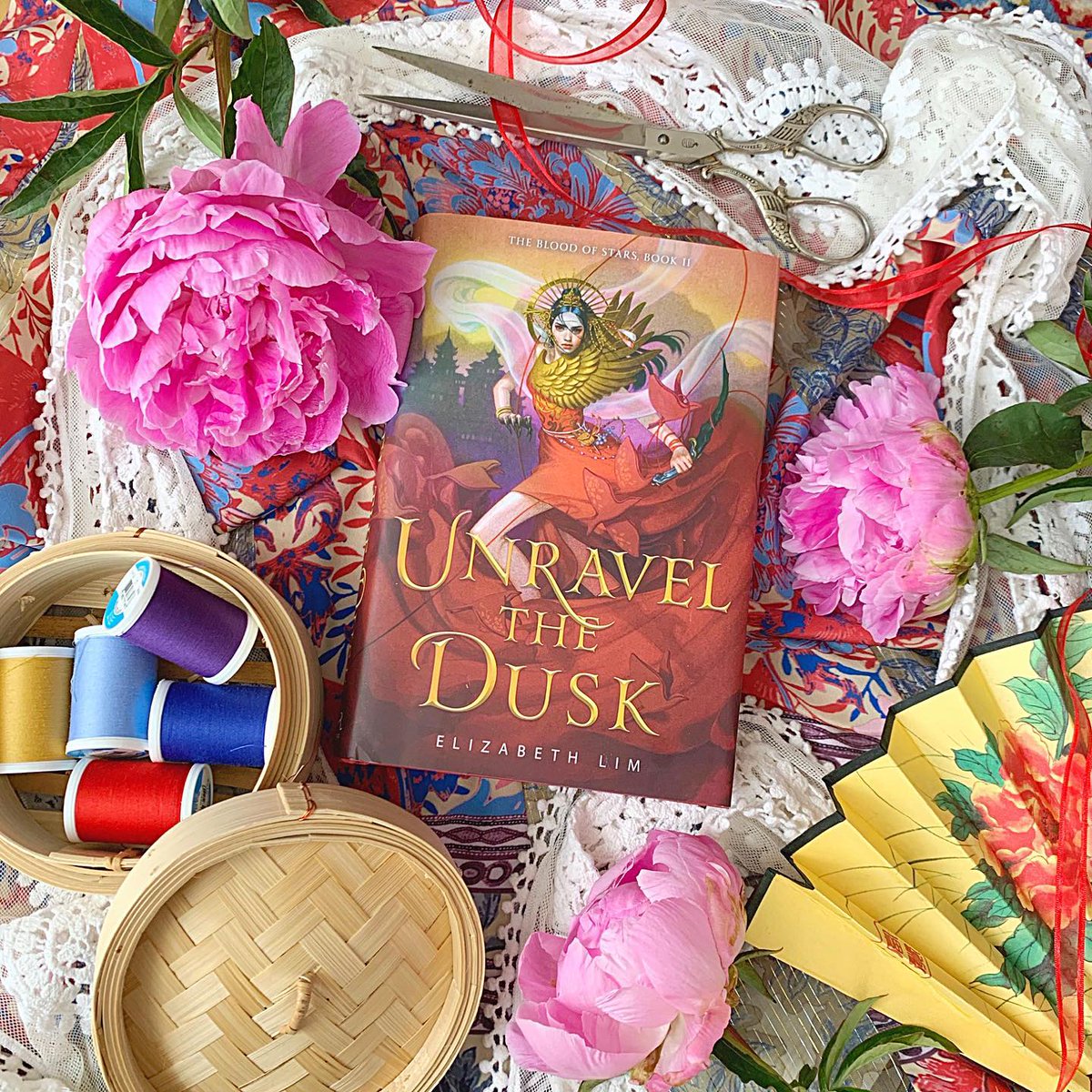 LizLim's tweet photo. Once upon a time, teen me dreamed of reading an Asian fantasy brimming with legend &amp; enchantment, with a hero who’s as inspiring as she is hardworking &amp; true. Last year, that book became real, &amp; today arrives the conclusion of her tale. Happy Birthday, Unravel the Dusk!😍🧵🔥❤️✂️ https://t.co/bqUakpIO9g