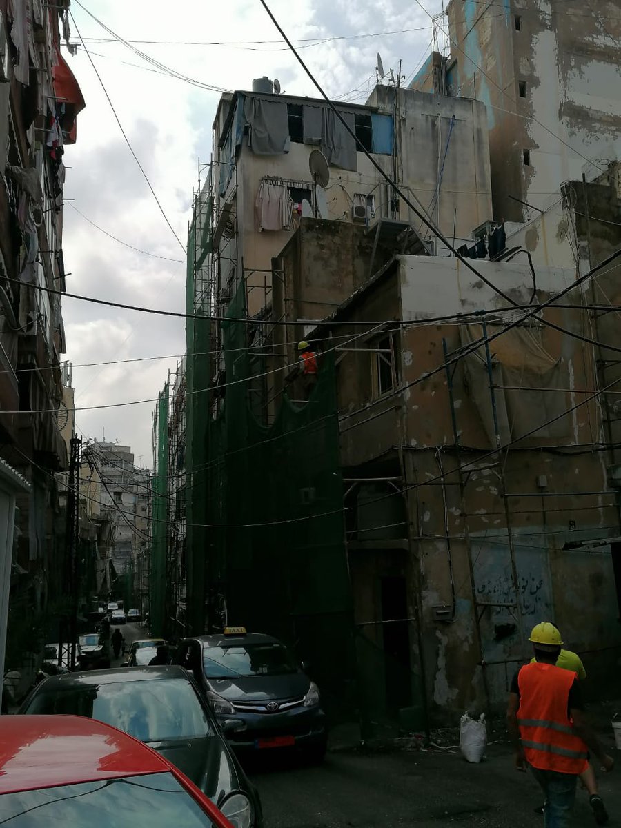 UNHabitatLB's tweet photo. The community-led upgrading project activities in #Sabra, funded by @NorwayinLebanon in partnership with @CityOfBeirut, are proceeding as planned.
Scaffoldings of the street's southern part are erected & facades rehabilitation started with site personnel adopting health measures. https://t.co/5RujU1JzHr