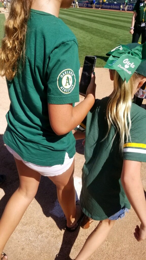 Mickeylover77's tweet photo. The moment my girls crossed homeplate at Oakland Coliseum last season (07/14/2019).  Man, I miss baseball.  Just 17 more days until we get to watch our boys in green &amp; gold take this same field 💚💛⚾️  Until then, keep the updates coming #CampColiseum @Athletics https://t.co/BBHpm6urBk