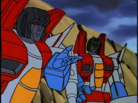 A screenshot of grainy 80s animation depicting two Starscreams seemingly in conversation.