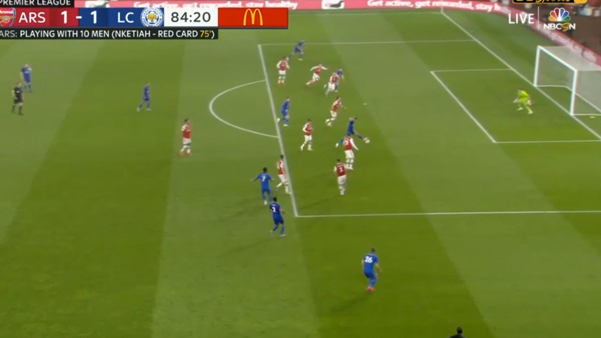 This changes at the point Ayoze Perez (who was onside) attempts to play the ball, as any touch would have created a new phase and made Vardy offside (he may look level with the ball on this camera angle).