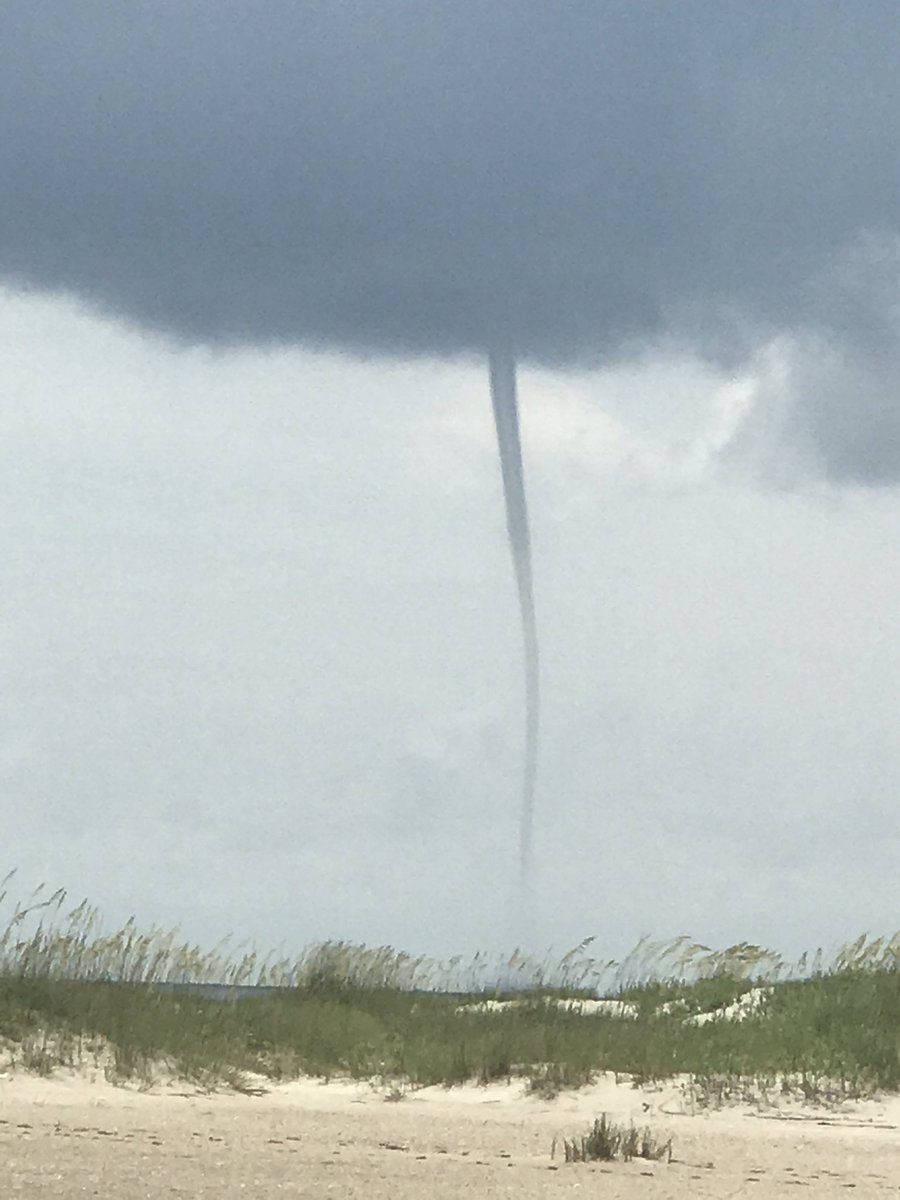 cyclegrrrl's tweet photo. Yesterday’s waterspout seen from Bald Head Island off the NC Coast. Sunny skies and a light breeze from where we were on Beach Access 1. @JimCantore @Ginger_Zee @BigweatherABC11 https://t.co/tSuttCgNy6