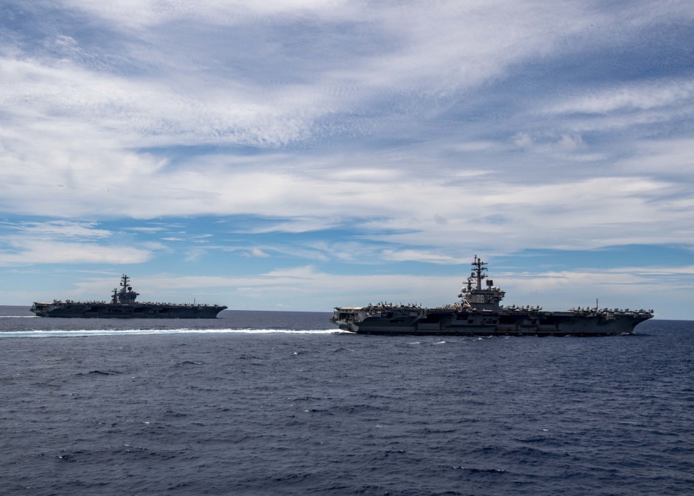 Aircraft from @USPacificFleet #CarrierAirWing5 and #CarrierAirWing17 fly in formation over the @US7thFleet #USSNimitz and @USSRonaldReagan Carrier Strike Groups #CSF.  #ForgedByTheSea #NavalReadiness #FreeandOpenIndoPacific.