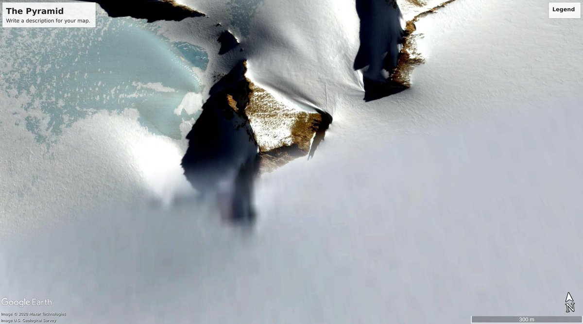 This is a screenshot of the pyramid from Google Earth and it's location on Google Maps near Queen Elisabeth Station. The blurriness is from them, not from me. Is this one of the entrances to the underground city?