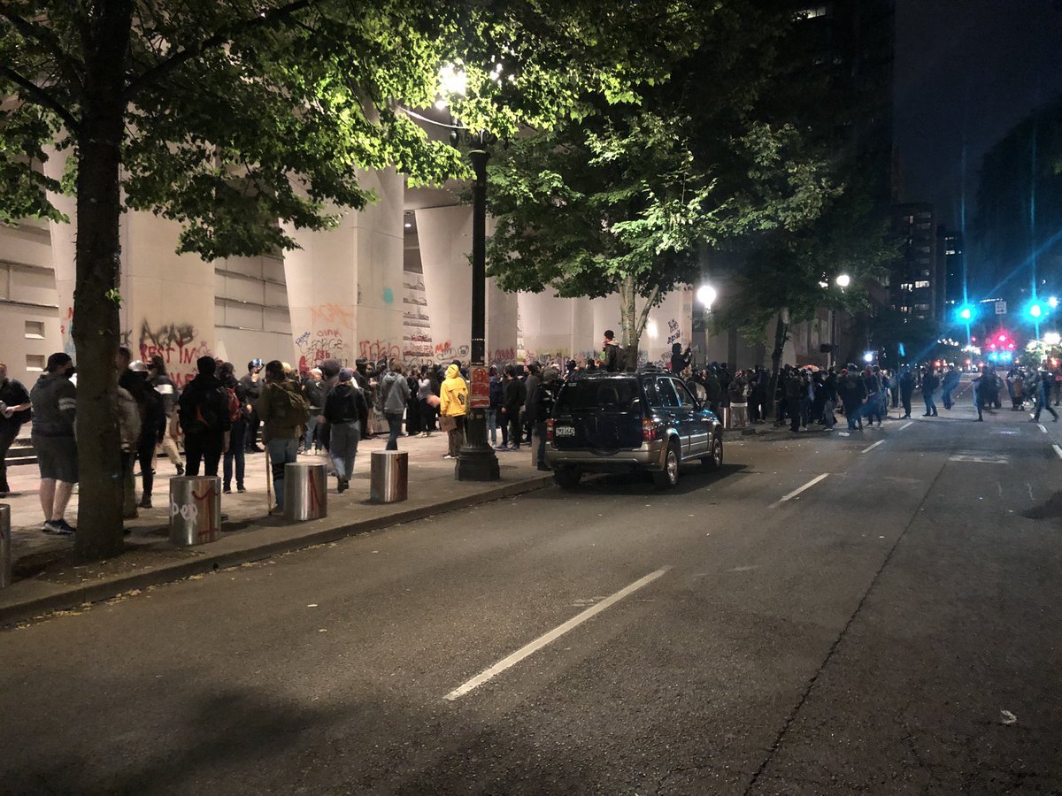 Downtown Portland, Tuesday July 7th. There are a few hundred people here in front of the Federal Courthouse, right next to the Justice Center, protesting for the 42nd night in a row.  #blacklivesmatter     #pdx  #portlandoregon  #oregon  #blm  #acab  #portland  #justicecenter