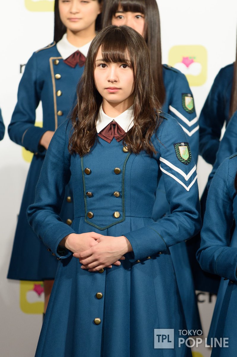 The uniforms between the junior and senior members differ with the trimming on the chest panel- juniors have a gold trim, while seniors had a dark green trim. (Neru had her own dark blue Hiragana costume)There is also a "summer" iteration of the uniform with short sleeves.