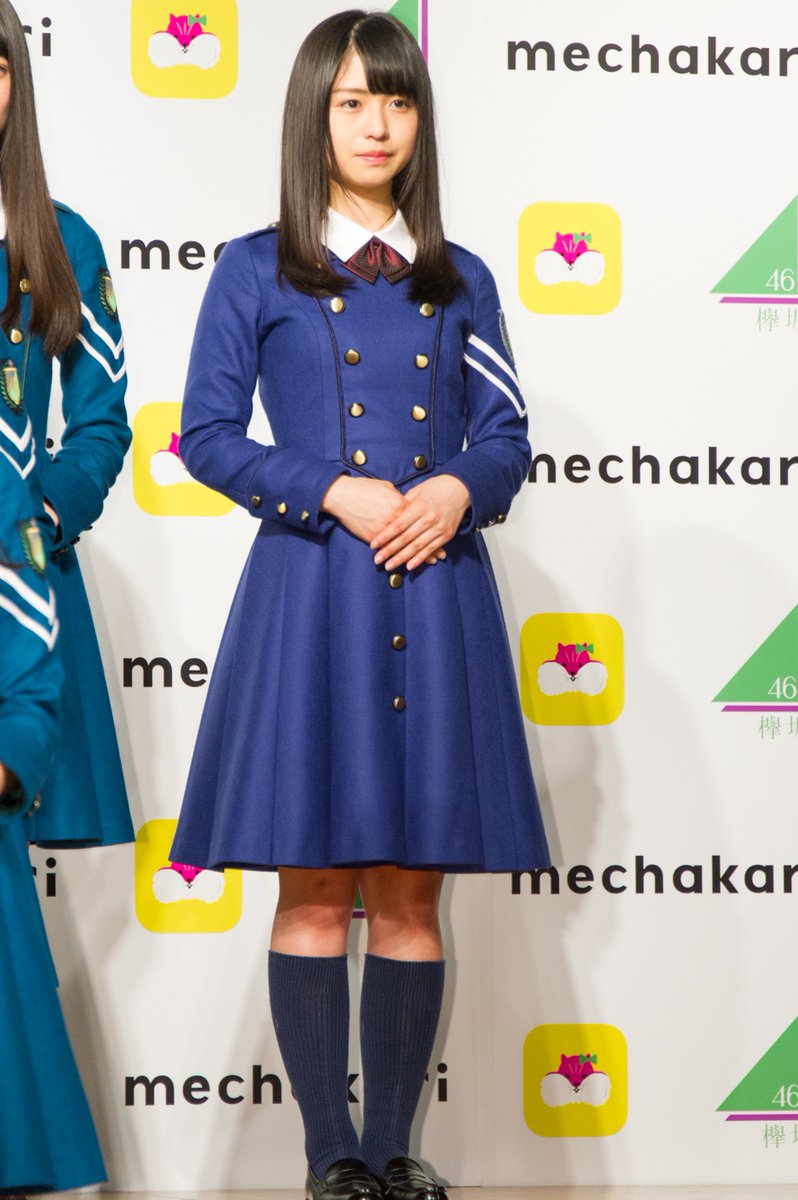 The uniforms between the junior and senior members differ with the trimming on the chest panel- juniors have a gold trim, while seniors had a dark green trim. (Neru had her own dark blue Hiragana costume)There is also a "summer" iteration of the uniform with short sleeves.