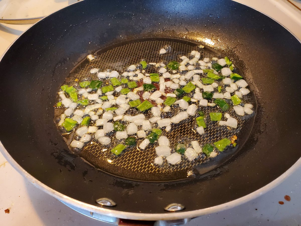 Today's breakfast is gonna be a thread, picked the first poblano off our plant so I made some dressed up migas #yomanfoodStep 1: heat some canola oil over medium heatCut some white onion and add to pan, then cut the pepper and add it to the pan