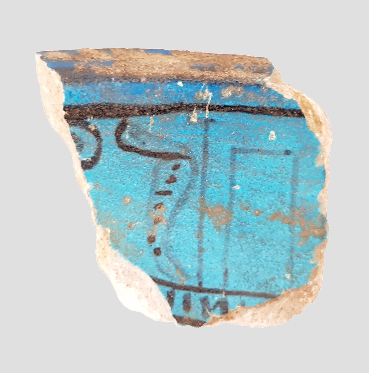 Our #objectoftheday is this fragment of a faience bowl, of unknown provenance. The decoration features a uraeus (rearing cobra) in front of what appears to be a cabin on a boat - we'd love to hear if people know of examples of Egyptian objects with a similar motif!