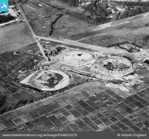 On the topic of cooling towers, let's take a look at a few more. Here's Croydon B Power Station towers under construction on 9 February 1948. https://britainfromabove.org.uk/en/image/EAW013170