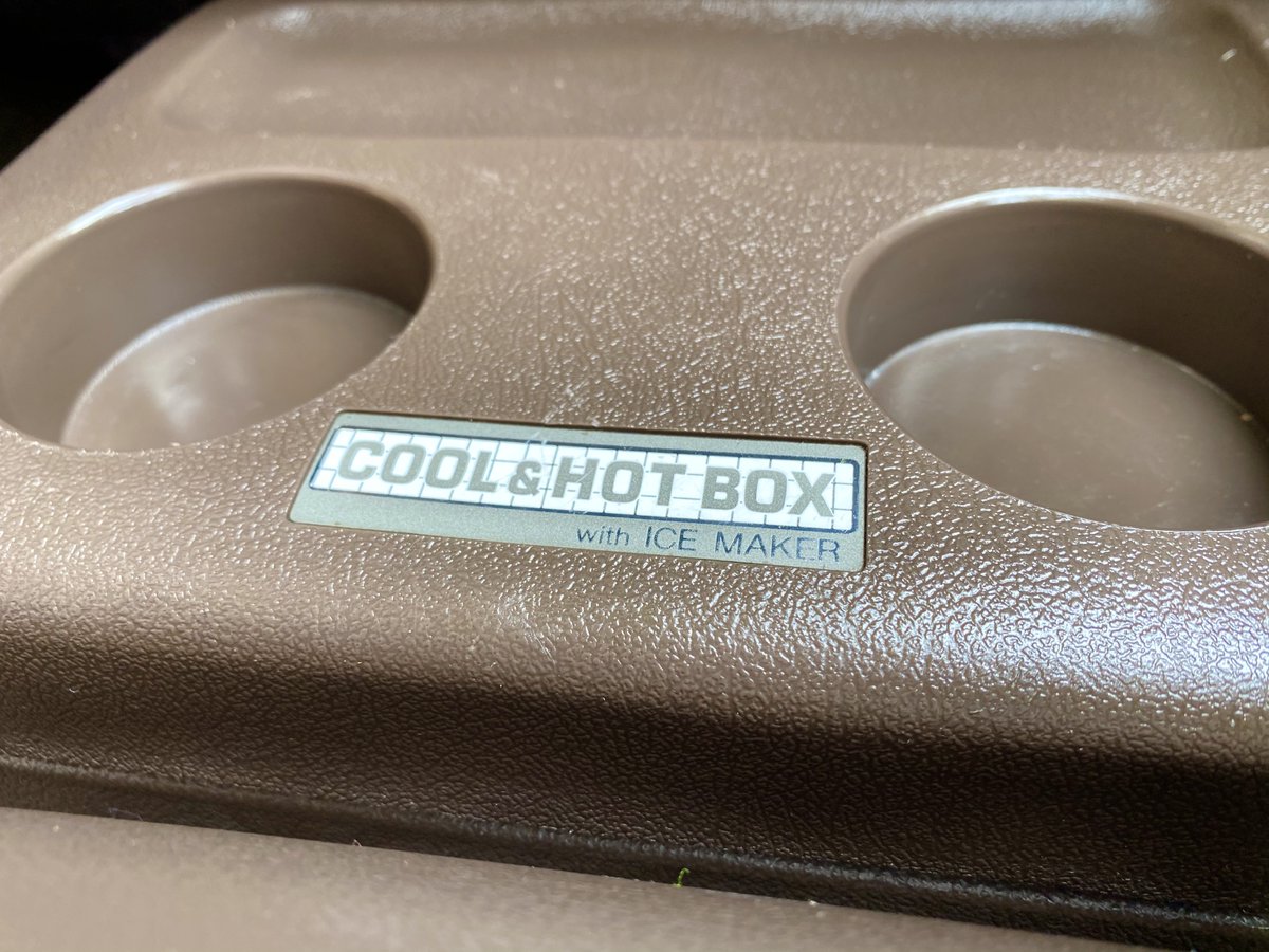 Two VERY IMPORTANT features. First, POWER CURTAINS. Seemingly a magnetic rail that, like a modern roller coaster launch, shoots the curtains (!) across at lightning speed!! Also the "Cool & Hot Box" will chill or heat your drinks and freeze ice?! It's tied into the AC lines?!