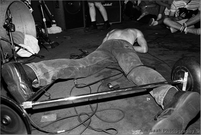 The Art of Album Covers..Ian MacKaye onstage during a Fugazi show in Washington, D.C. Photo taken by Jim Saah..Used by Fugazi on Repeater, released 1990